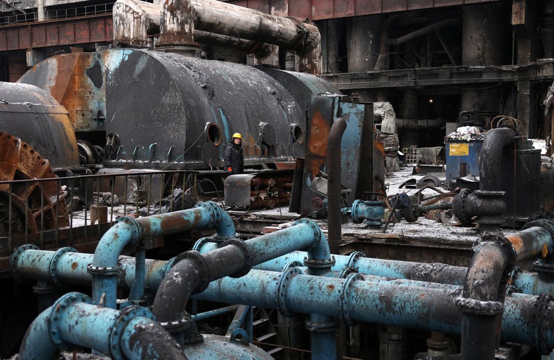 Workers are standing on December 5, 2024 when equipment is repaired at a thermal power plant damaged by a missile attack in a private location in Ukraine.