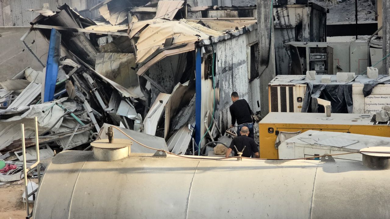 People check the damage outside the Kamal Adwan hospital in Beit Lahia in the northern Gaza Strip, following Israeli strikes around the medical complex on December 6, 2024, as the war between Israel and the Palestinian Hamas militant group continues. (Photo by AFP) (Photo by -/AFP via Getty Images)