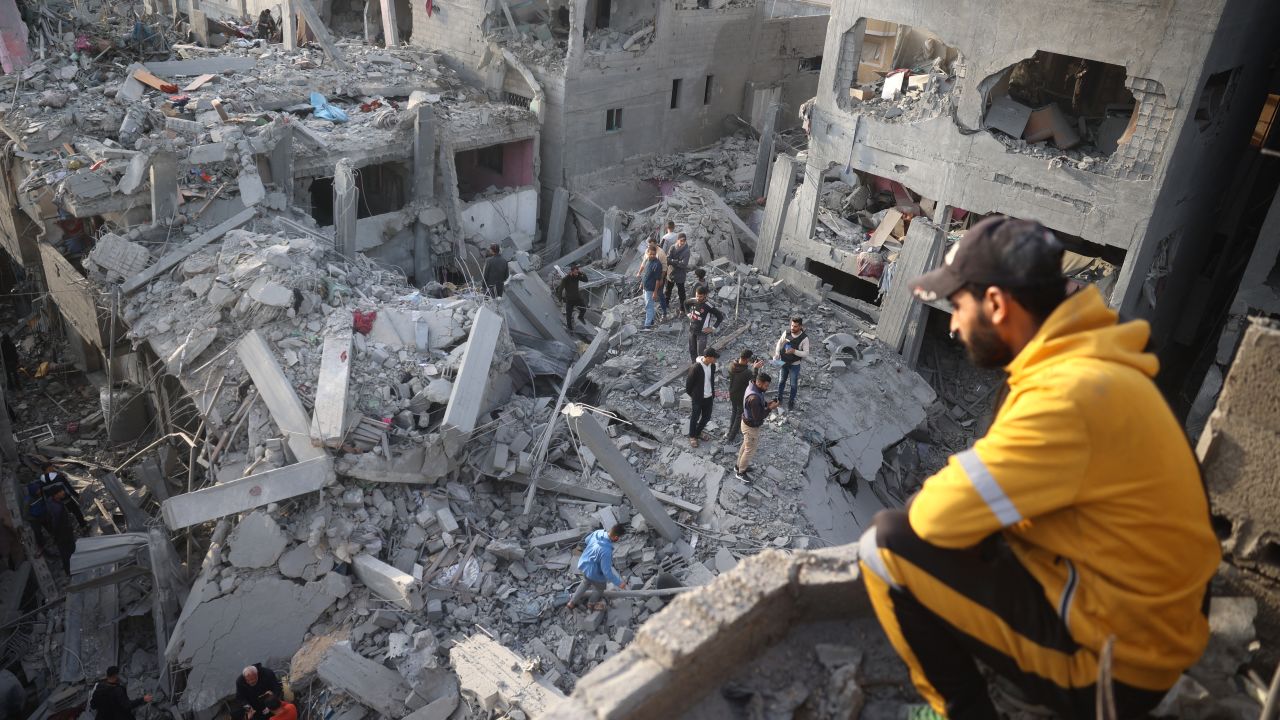 Palestinians inspect the damage after an Israeli strike on the Nuseirat refugee Camp in the central Gaza Strip on December 7, 2024, amid the ongoing conflict between Israel and the Palestinian Hamas militant group. (Photo by Eyad BABA / AFP) (Photo by EYAD BABA/AFP via Getty Images)