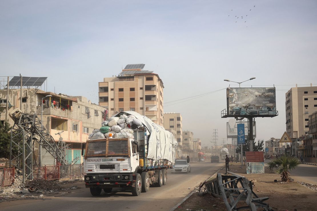 A truck carrying humanitarian aid drives on the main Salah al-Din road in the Nuseirat refugee camp in central Gaza on December 7, 2024.