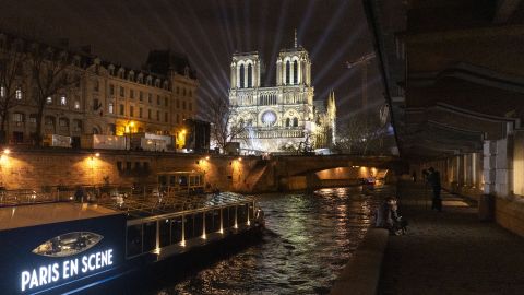A tourist boat in front of Notre Dame Cathedral ahead of its formal reopening for the first time since a devastating fire, in Paris, France, on Friday, Dec. 6, 2024.