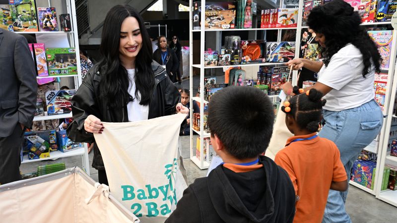 A heart-warming scene as celebrities help Christmas come early for children in South Los Angeles