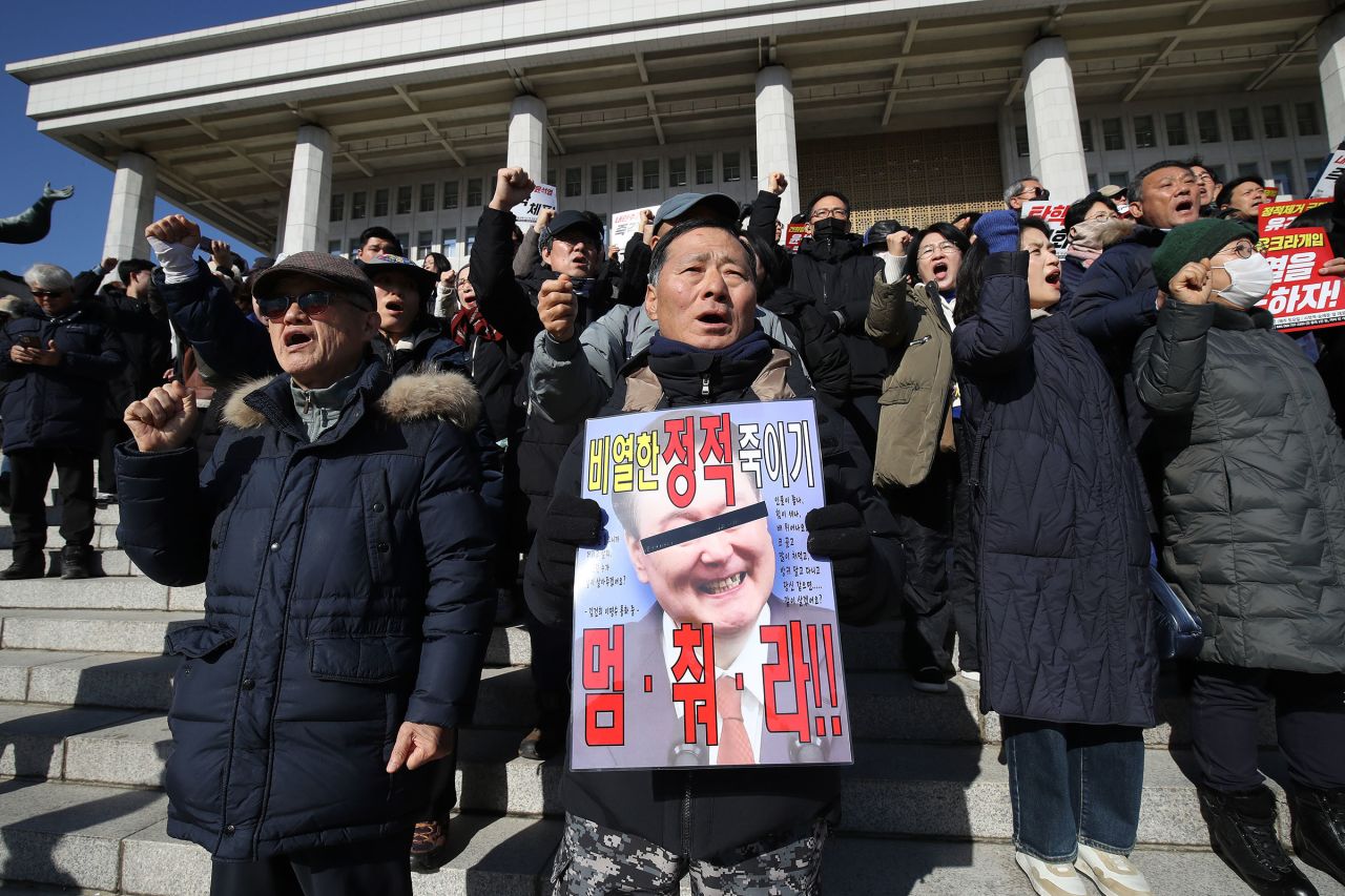 Protesters demonstrate against President Yoon Suk Yeol at the National Assembly in Seoul, South Korea, on December 4, 2024.