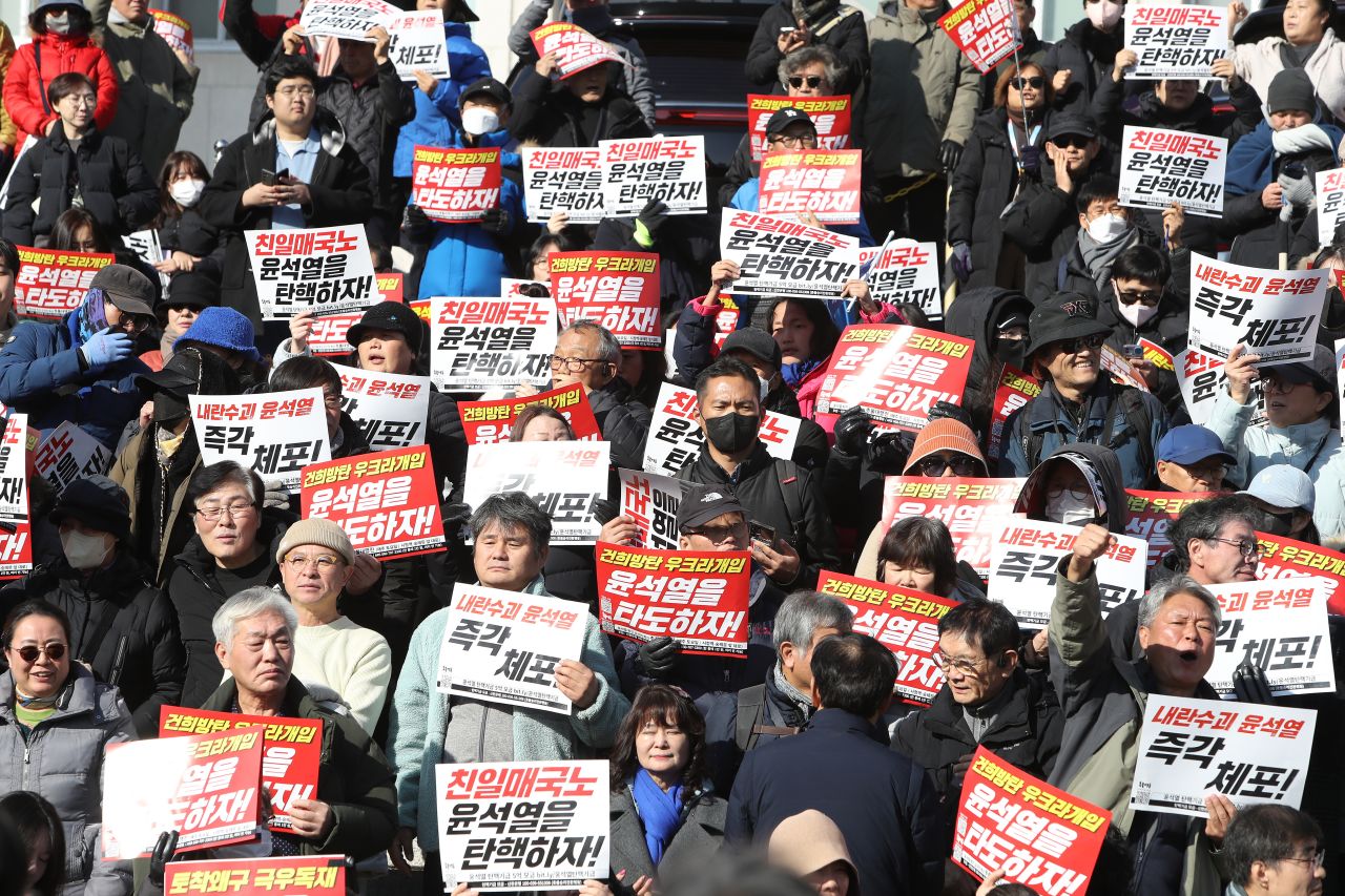 Members of the South Korea's main opposition Democratic Party demonstrate against the country's president at the National Assembly on Wednesday, December 04, in Seoul.