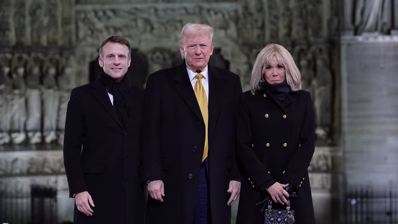 French President Emmanuel Macron (L) and his wife Brigitte Macron (R) pose with US President-elect Donald Trump (C) outside Notre-Dame Cathedral ahead of a ceremony to mark the re-opening of the landmark cathedral, in central, Paris on December 7, 2024. Around 50 heads of state and government are expected in the French capital to attend the ceremony marking the rebuilding of the Gothic masterpiece five years after the 2019 fire which ravaged the world heritage landmark and toppled its spire. Some 250 companies and hundreds of experts were part of the five-year restoration project at a cost of hundreds of millions of euros.