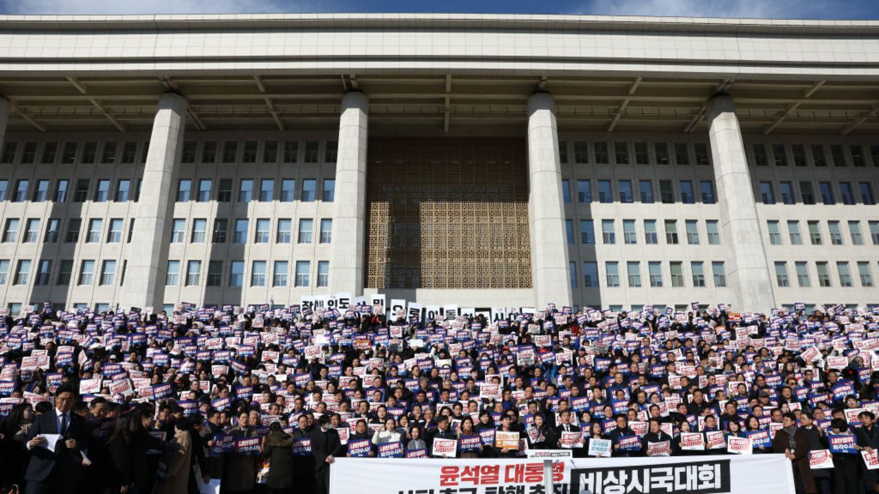 SEOUL, SOUTH KOREA - DECEMBER 04: Lawmakers and members of the South Korea's main opposition Democratic Party (DP) demonstrate against the country's president at the National Assembly on December 04, 2024 in Seoul, South Korea. South Korean lawmakers voted to lift the declaration of emergency martial law announced earlier by President Yoon Suk Yeol in a televised speech. Since taking office two years ago, Mr Yoon has struggled to push his agendas against an opposition-controlled parliament. (Photo by Chung Sung-Jun/Getty Images)