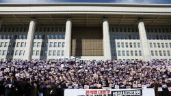 SEOUL, SOUTH KOREA - DECEMBER 04: Lawmakers and members of the South Korea's main opposition Democratic Party (DP) demonstrate against the country's president at the National Assembly on December 04, 2024 in Seoul, South Korea. South Korean lawmakers voted to lift the declaration of emergency martial law announced earlier by President Yoon Suk Yeol in a televised speech. Since taking office two years ago, Mr Yoon has struggled to push his agendas against an opposition-controlled parliament. (Photo by Chung Sung-Jun/Getty Images)