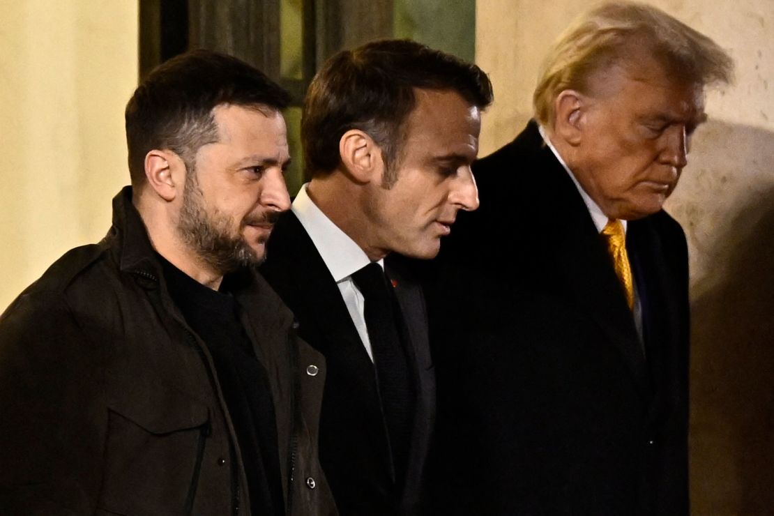 Ukrainian President Volodymyr Zelensky walks with French President Emmanuel Macron and then- president-elect Donald Trump after a meeting at the Elysee Presidential Palace in Paris on December 7, 2024.