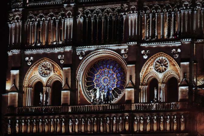 Notre Dame is illuminated during a ceremony to mark its reopening on Saturday, December 8.