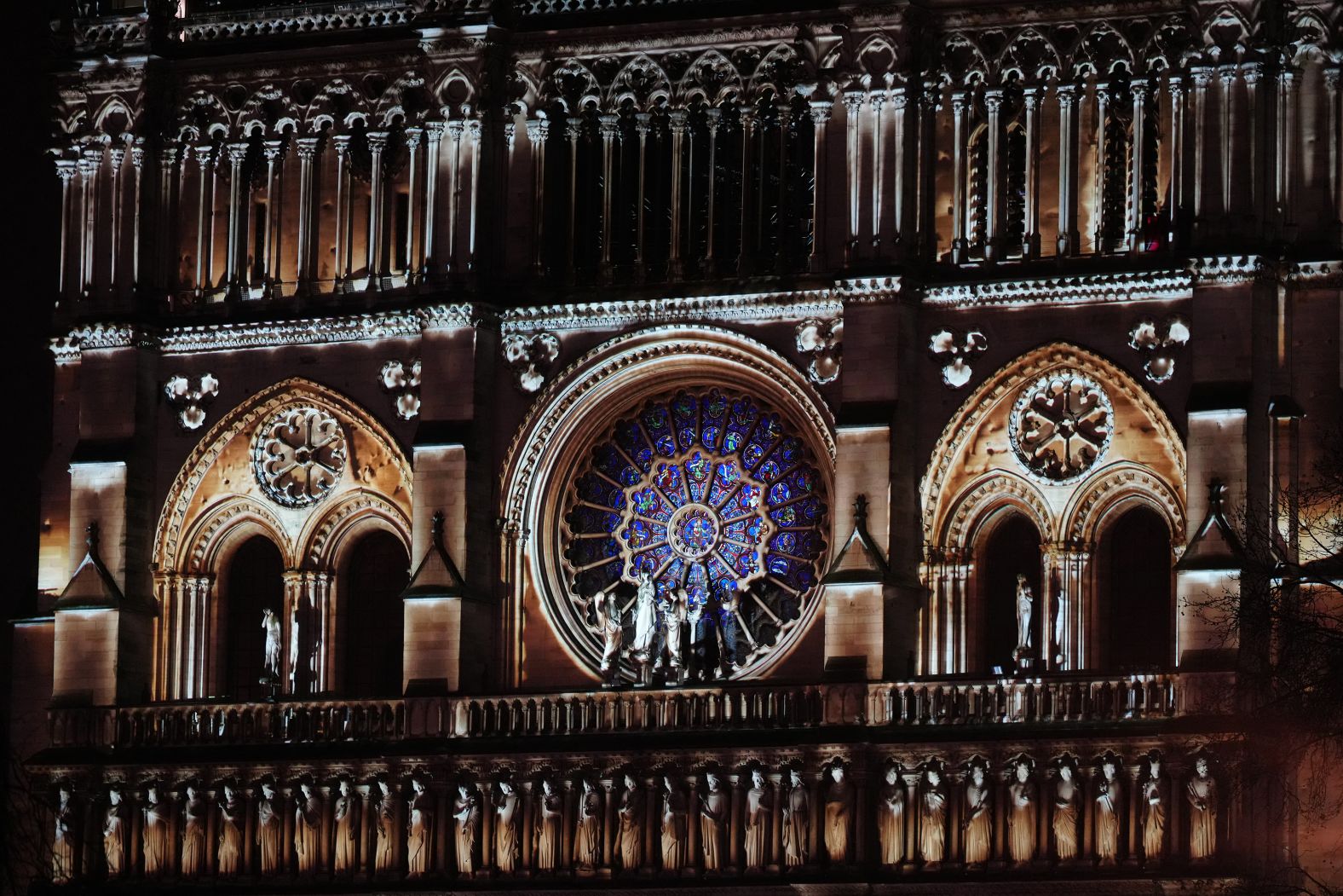 Notre Dame is illuminated during a ceremony to mark its reopening on Saturday, December 8.