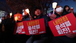 SEOUL, SOUTH KOREA - DECEMBER 04: Protesters demonstrate against the country's president on December 04, 2024 in Seoul, South Korea. South Korean lawmakers voted to lift the declaration of emergency martial law announced earlier by President Yoon Suk Yeol in a televised speech. Since taking office two years ago, Mr Yoon has struggled to push his agendas against an opposition-controlled parliament. (Photo by Chung Sung-Jun/Getty Images)