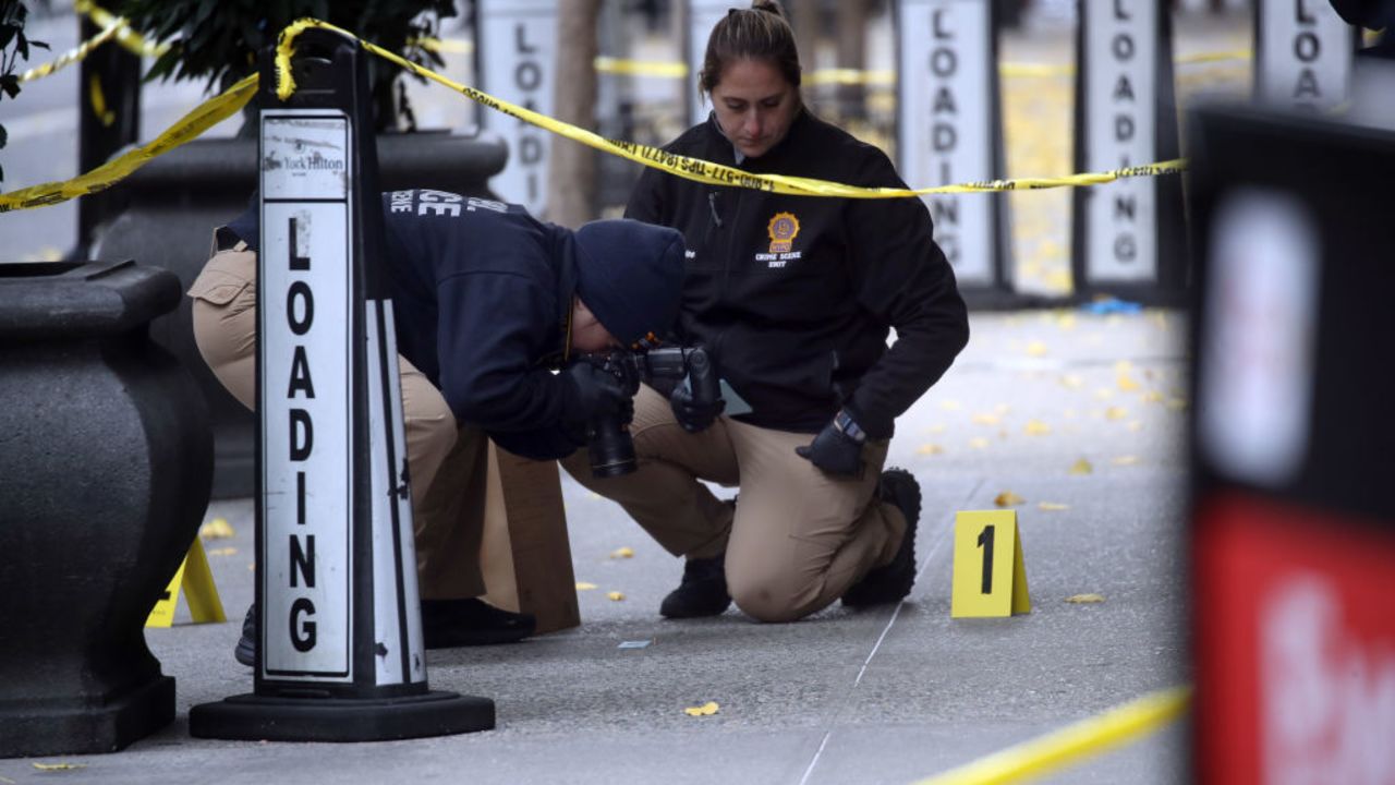 NEW YORK, NEW YORK - DECEMBER 04: Police place bullet casing markers outside of a Hilton Hotel in Midtown Manhattan where United Healthcare CEO Brian Thompson was fatally shot on December 04, 2024 in New York City. Brian Thompson was shot and killed before 7:00 AM this morning outside the Hilton Hotel, just before he was set to attend the company's annual investors' meeting. (Photo by Spencer Platt/Getty Images)