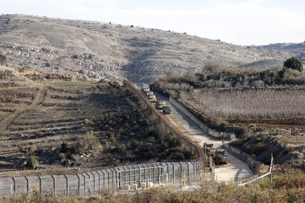 Israeli tanks take position on the border with Syria near the Druze village of Majdal Shams in the Israel-annexed Golan Heights on December 8.