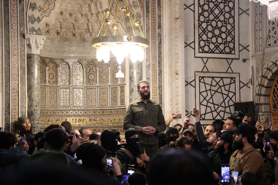 Abu Mohammed al-Jolani, the chief of Hayat Tahrir al-Sham (HTS), addresses a crowd at the Umayyad Mosque, in Damascus, on December 8. He signaled "a new chapter in the history of the region."