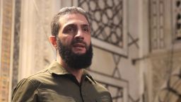 The leader of Syria's Islamist Hayat Tahrir al-Sham (HTS) group that headed a lightning rebel offensive snatching Damascus from government control, Abu Mohammed al-Jolani, address a crowd at the capital's landmark Umayyad Mosque on December 8, 2024. Jolani, now using his real name Ahmed al-Sharaa, gave a speech as the crowd chanted "Allahu akbar (God is greatest)," a video shared by the rebels on their Telegram channel showed.