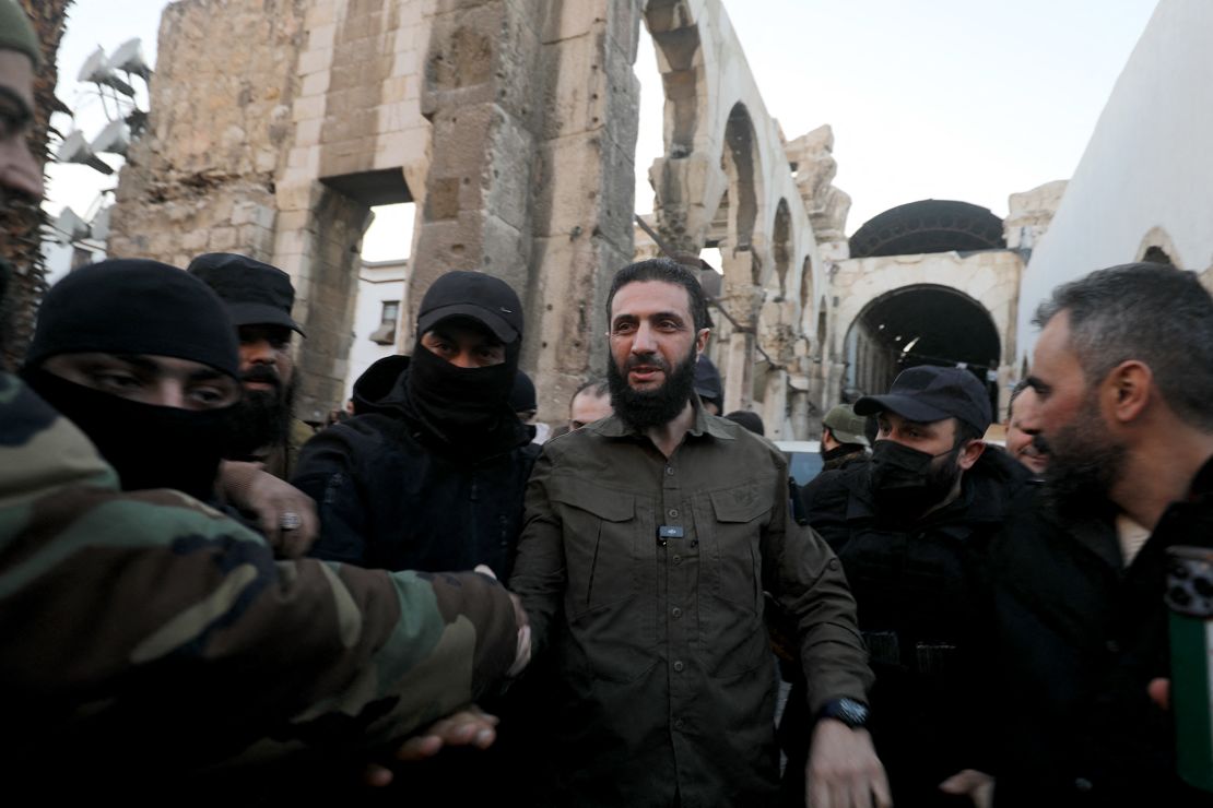 The leader of Hayat Tahrir al-Sham (HTS) group that headed a lightning rebel offensive snatching Damascus from government control, Abu Mohammed al-Jolani, is welcomed by supporters before addressing a crowd at the capital's landmark Umayyad Mosque on Sunday.