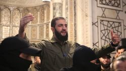 TOPSHOT - The leader of Syria's Islamist Hayat Tahrir al-Sham (HTS) group that headed a lightning rebel offensive snatching Damascus from government control, Abu Mohammed al-Jolani, address a crowd at the capital's landmark Umayyad Mosque on December 8, 2024. Jolani, now using his real name Ahmed al-Sharaa, gave a speech as the crowd chanted "Allahu akbar (God is greatest)," a video shared by the rebels on their Telegram channel showed. (Photo by Aref TAMMAWI / AFP) (Photo by AREF TAMMAWI/AFP via Getty Images)