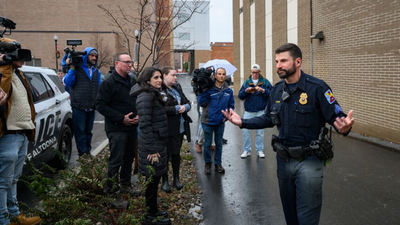 ALTOONA, PENNSYLVANIA - DECEMBER 9: An Altoona Police officer updates members of the media outside the Altoona Police Department on December 9, 2024 in Altoona, Pennsylvania. A suspect in the fatal shooting of United Healthcare CEO Brian Thompson was detained at a McDonald's and is being questioned by local police and members of the New York Police Department who have arrived on the scene. (Photo by Jeff Swensen/Getty Images)