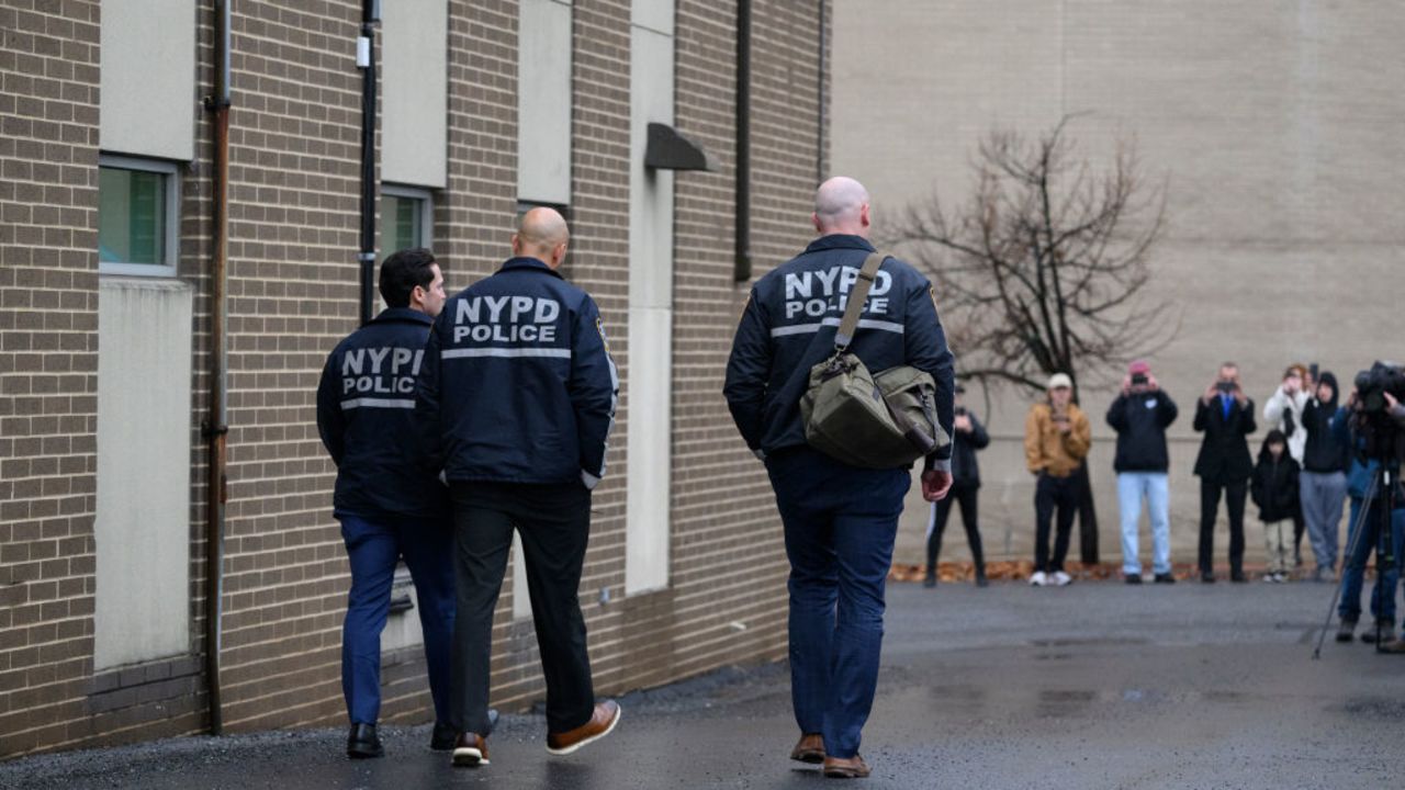 ALTOONA, PENNSYLVANIA - DECEMBER 9: Members of the New York Police Department enter the Altoona Police Department on December 9, 2024 in Altoona, Pennsylvania. A suspect in the fatal shooting of United Healthcare CEO Brian Thompson was detained at a McDonald's and is being questioned by local police. (Photo by Jeff Swensen/Getty Images)