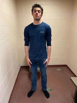 In this photo released by the Altoona Police Department, Luigi Mangione is seen in a holding cell after being taken into custody.