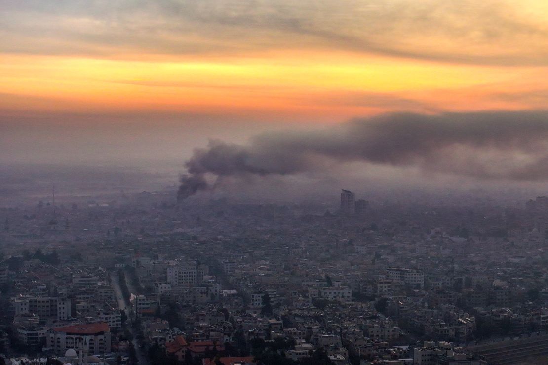 Smoke billows following Israeli airstrikes in Damascus on December 10.