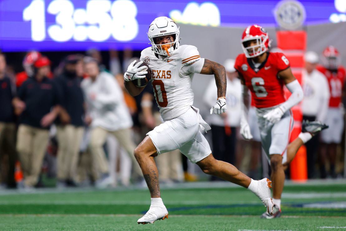 Longhorns wide receiver DeAndre Moore Jr. (No. 0) scores a touchdown against the Bulldogs at the 2024 SEC Championship.