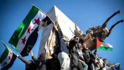 ISTANBUL, TURKEY - DECEMBER 08: Syrians living in Turkey celebrate with opposition flags after Syrian rebels announced that they have ousted Bashar al-Assad on December 08, 2024 in Istanbul, Turkey. Rebel forces in Syria claimed that they had retaken the capital from longtime ruler Bashar al-Assad, who was reported to have fled the country. Syria has been mired in a multi-party civil war since 2011, amid the Arab Spring uprisings. (Photo by Burak Kara/Getty Images)