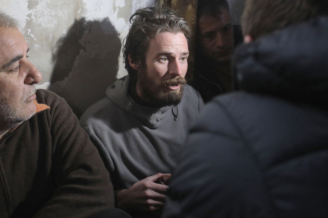 Travis Timmerman speaks with reporters in a house in Damascus, Syria, on December 12.