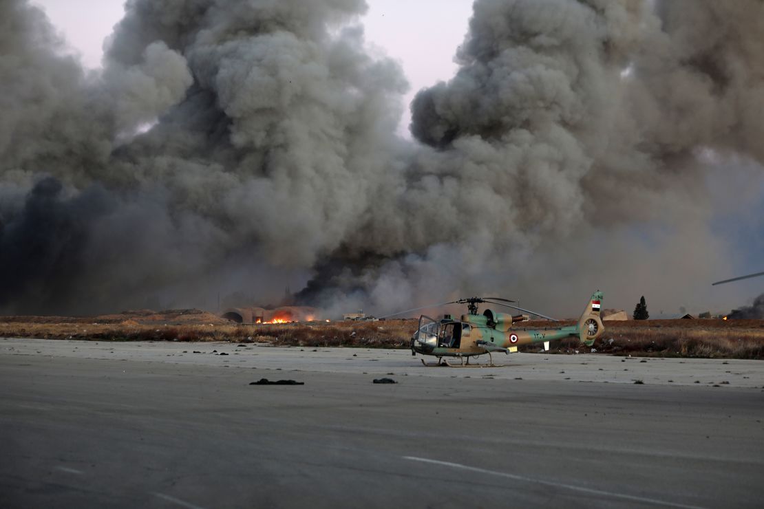 The aftermath of suspected Israeli strikes near Mezzeh Air Base, outside Damascus, on December 8.