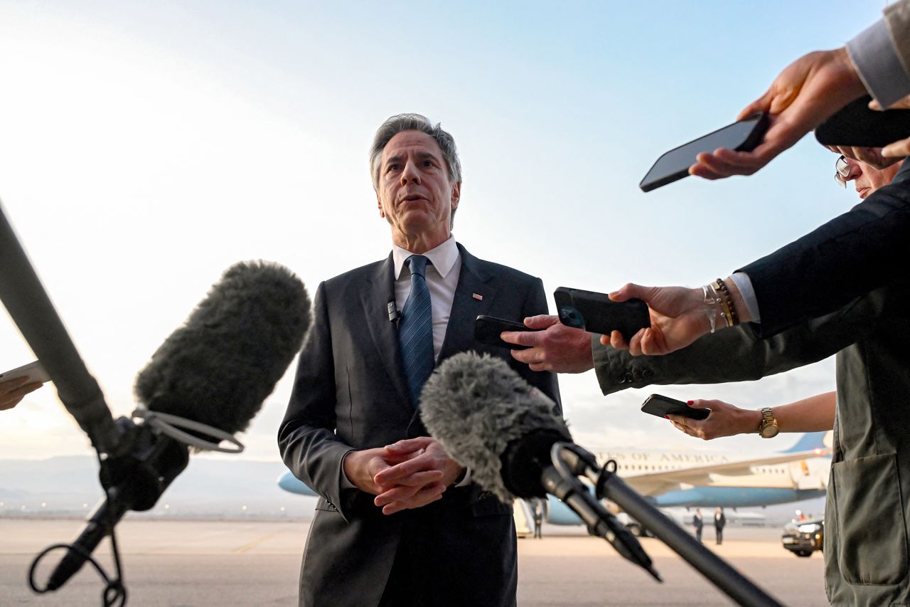 US Secretary of State Antony Blinken speaks to reporters on the tarmac before his departure from King Hussein International Airport in Jordan on December 12.