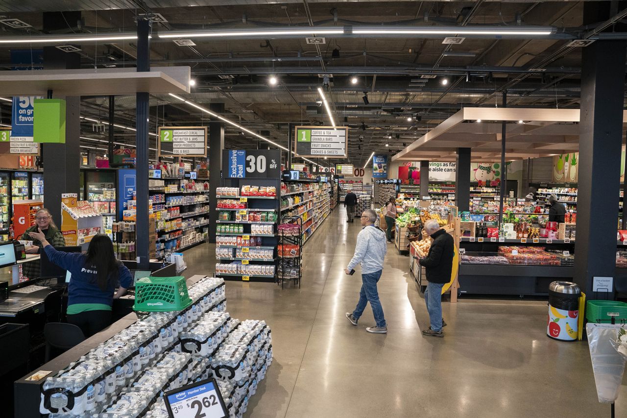 Shoppers enter an Amazon Fresh grocery store on December 12 in Federal Way, Washington.