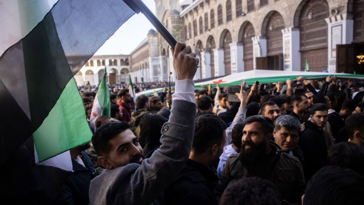 DAMASCUS, SYRIA - DECEMBER 13: People erupt in celebration after performing the first Friday prayer since the fall of the Assad regime at the Umayyad Mosque on December 13, 2024 in Damascus, Syria. Rebel forces in Syria have retaken the capital from longtime ruler Bashar al-Assad, who has fled the country for Moscow. The fall of the Assad regime marks a new chapter for Syria, which has been mired in a multi-party civil war since 2011, sparked by the Arab Spring uprisings. (Photo by Chris McGrath/Getty Images)