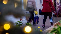 Shoppers carry bags at Broadway Plaza in Walnut Creek, California, on Monday, Dec. 16, 2024.