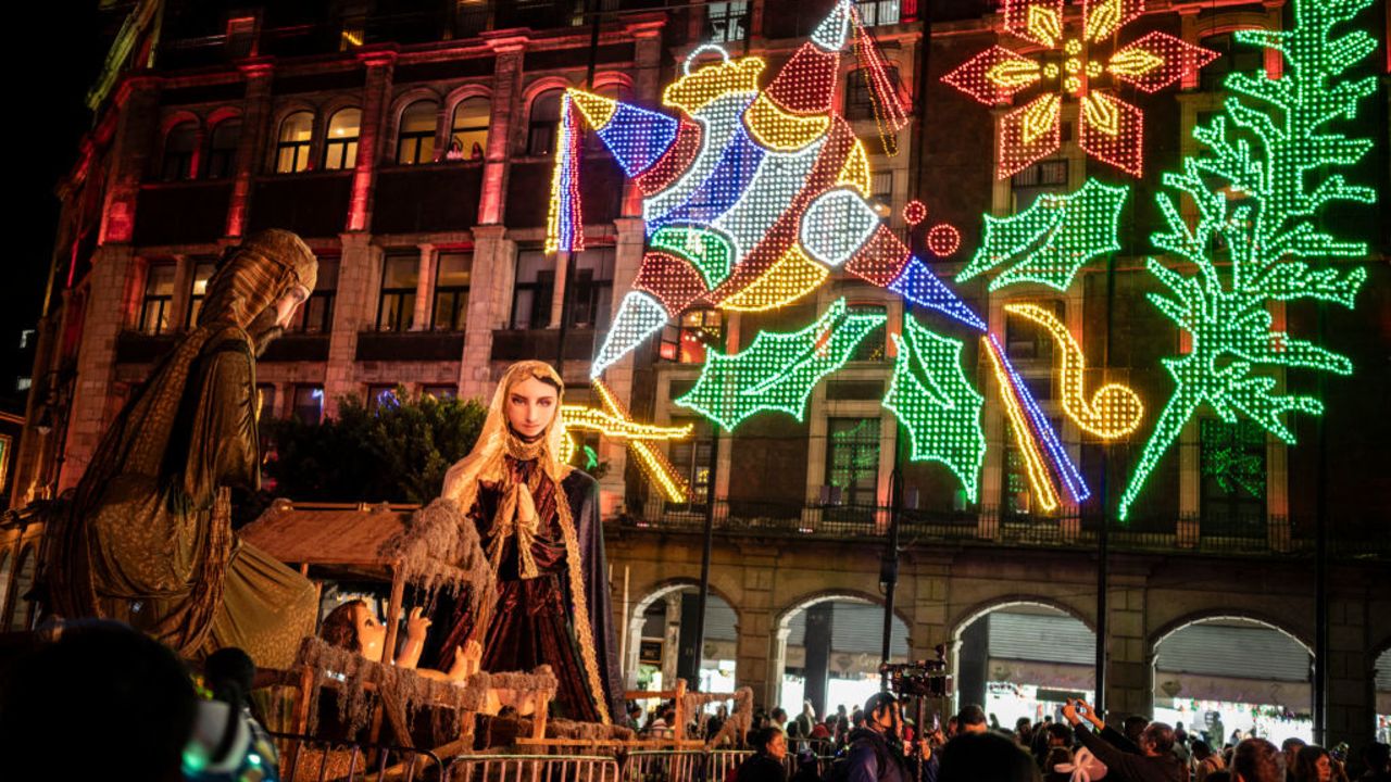 People attend the inauguration ceremony for the lighting of El Zocalo Square as part of the Mexico City government's Christmas celebrations on December 17, 2024. (Photo by Yuri CORTEZ / AFP) (Photo by YURI CORTEZ/AFP via Getty Images)