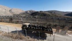 An Israeli army vehicle transports soldiers into the UN-patrolled buffer zone in the annexed Golan Heights on December 18, 2024. Since the toppling of Syrian president Bashar al-Assad on December 8, Israel has sparked international condemnation with its moves in the Golan, a strategic territory it has mostly occupied since 1967 and annexed in 1981 in a move recognised only by the US during Donald Trump's first term as president. (Photo by Jalaa MAREY / AFP) (Photo by JALAA MAREY/AFP via Getty Images)