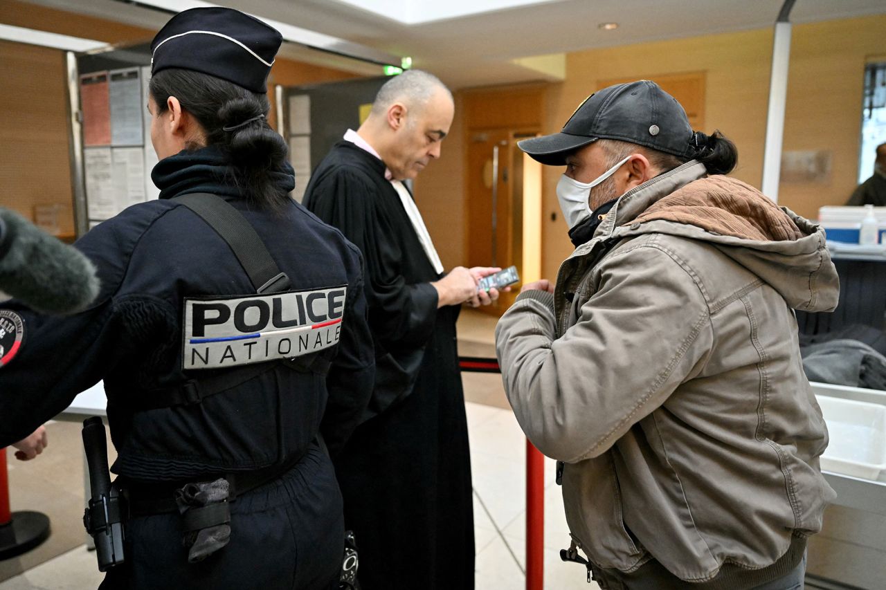 One of the defendant arrives at the courthouse in Avignon on December 19.