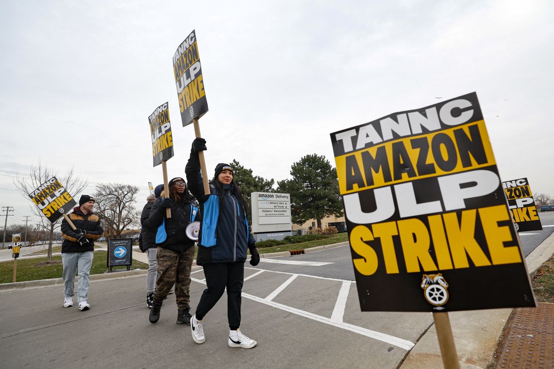 Amazon delivery drivers walk the picket line outside Amazon delivery station as they went on strike in Skokie, Illinois in December.