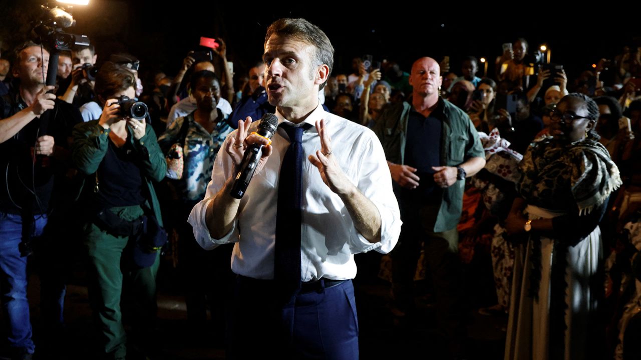 France's President Emmanuel Macron speaks to the local residents during his visit in Pamandzi, on the French Indian Ocean territory of Mayotte on December 19, 2024. Distraught and angry inhabitants of Mayotte shouted out their despair to French President Emmanuel Macron during his visit on December 19, five days after the Indian Ocean archipelago was devastated by a cyclone, with lacking water and food, and fear of looting topping the grievances. (Photo by Ludovic MARIN / POOL / AFP) (Photo by LUDOVIC MARIN/POOL/AFP via Getty Images)