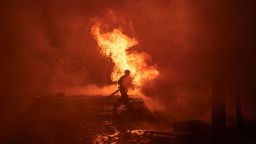 Ukrainian first responders work the site of a Russian missile strike on the city center of Kyiv, Ukraine, on December 20, 2024.