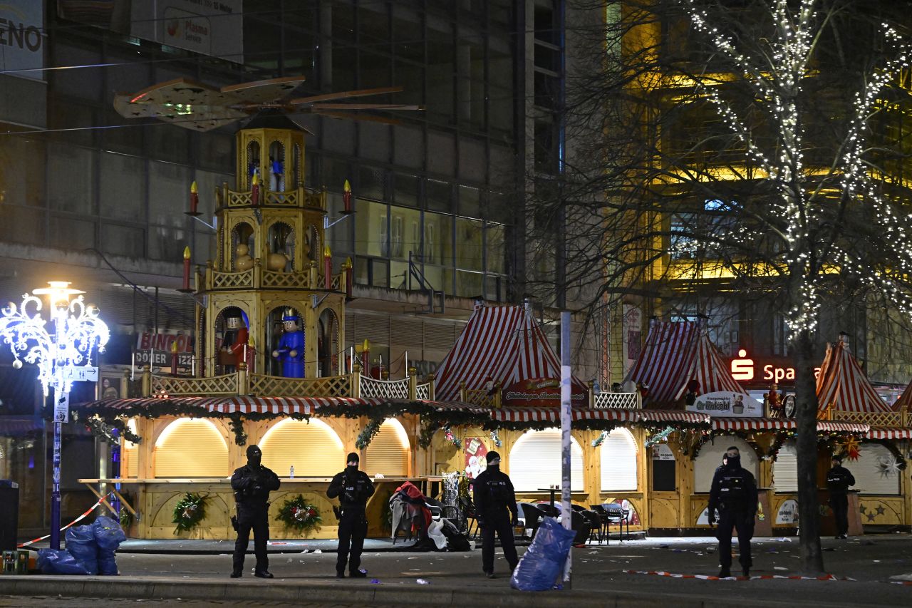 Security forces stand guard at the entrance of the Christmas market in Magdeburg, Germany, on December 21.