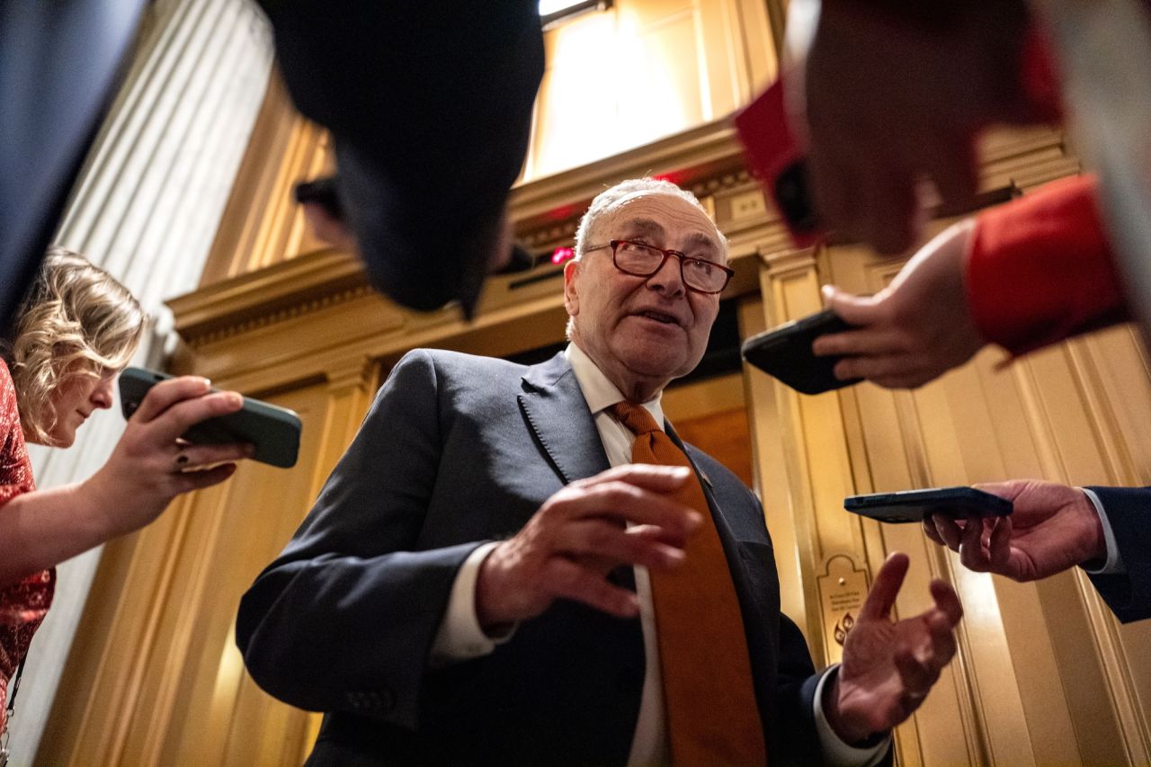 Senate Majority Leader Chuck Schumer speaks with reporters at the Capitol on Friday night.