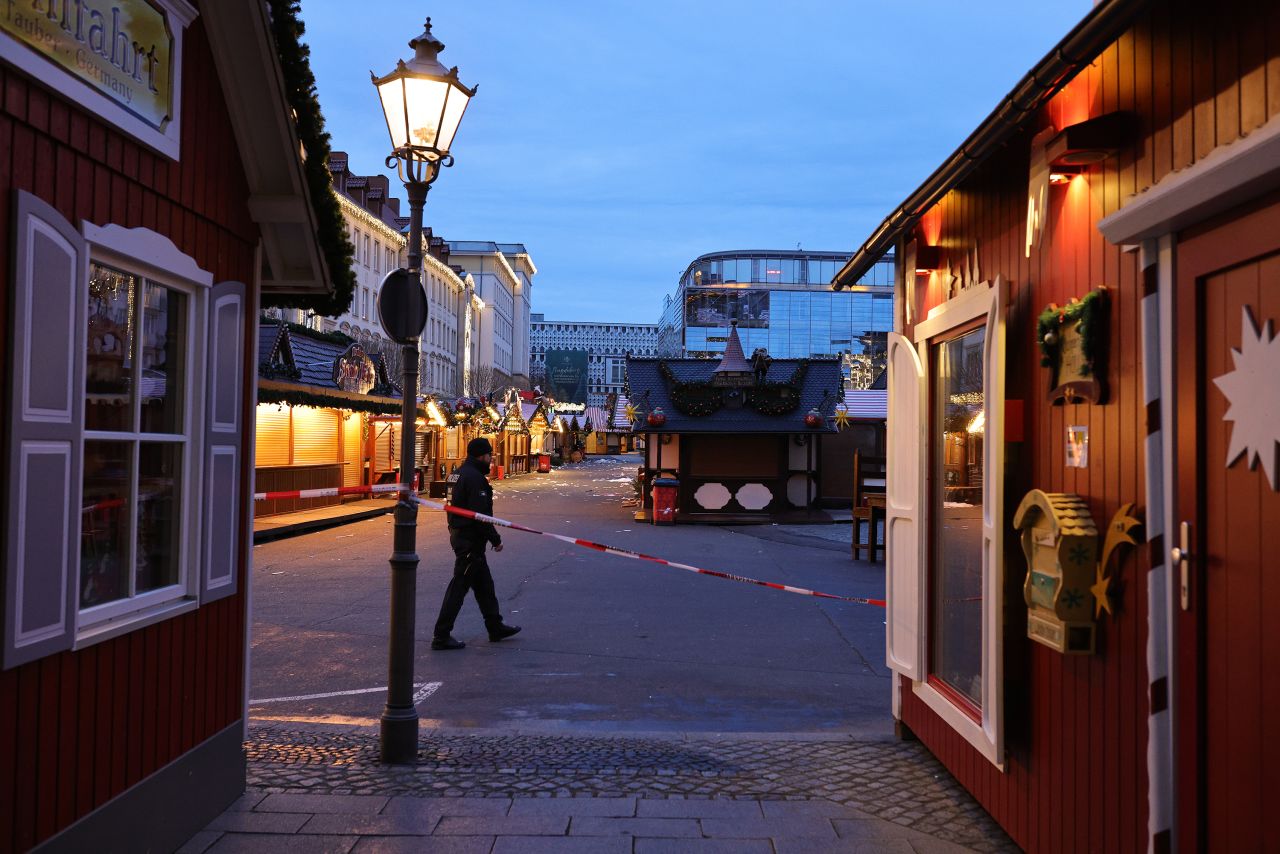 A police officer walks through the shuttered Christmas market in Magdeburg, Germany, on December 21.