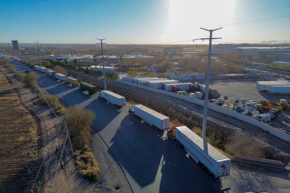 Tractor trailers wait in line at the Ysleta-Zaragoza International Bridge port of entry on the US-Mexico border in Juarez, Chihuahua state, Mexico, on December 20, 2024.