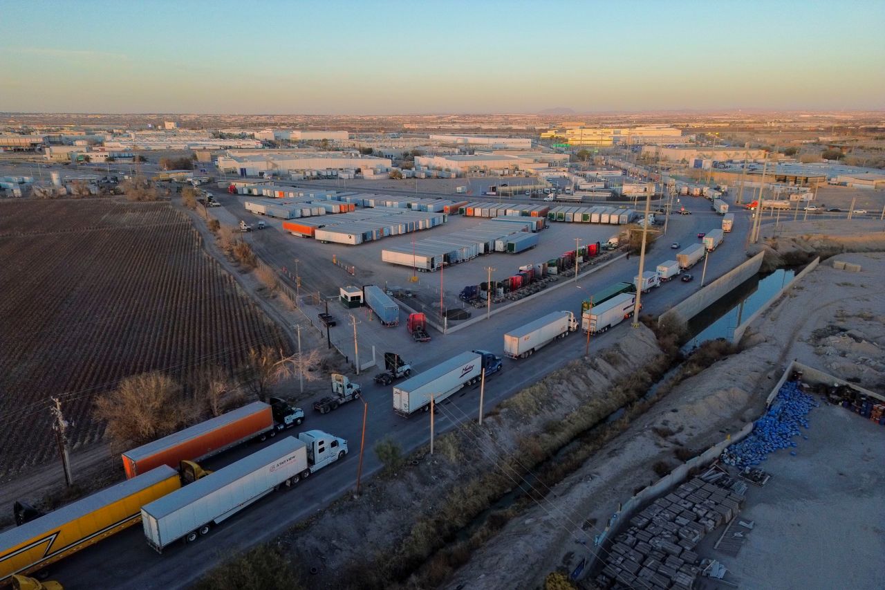 Tractor trailers wait in line at the Ysleta-Zaragoza International Bridge port of entry, on the US-Mexico border in Juarez, Chihuahua state, Mexico, on December 20, 2024.