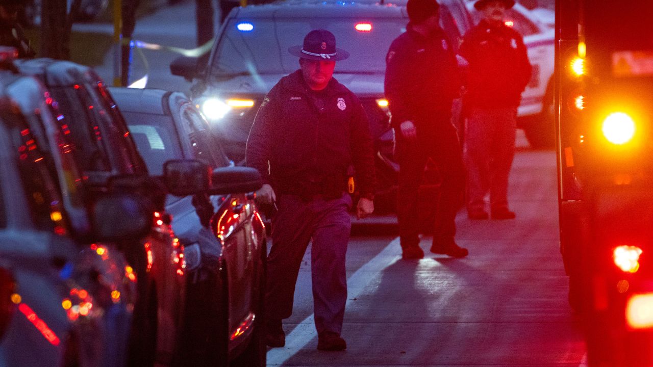 MADISON, WISCONSIN - DECEMBER 16: Police officers stand guard near the Abundant Life Christian School on December 16, 2024 in Madison, Wisconsin. A student and teacher were shot and killed and the alleged shooter, who police say they believe to have been a student at the school, was found dead at the scene, according to published reports. Six others were injured with two in critical condition, the reports said.  (Photo by Scott Olson/Getty Images)