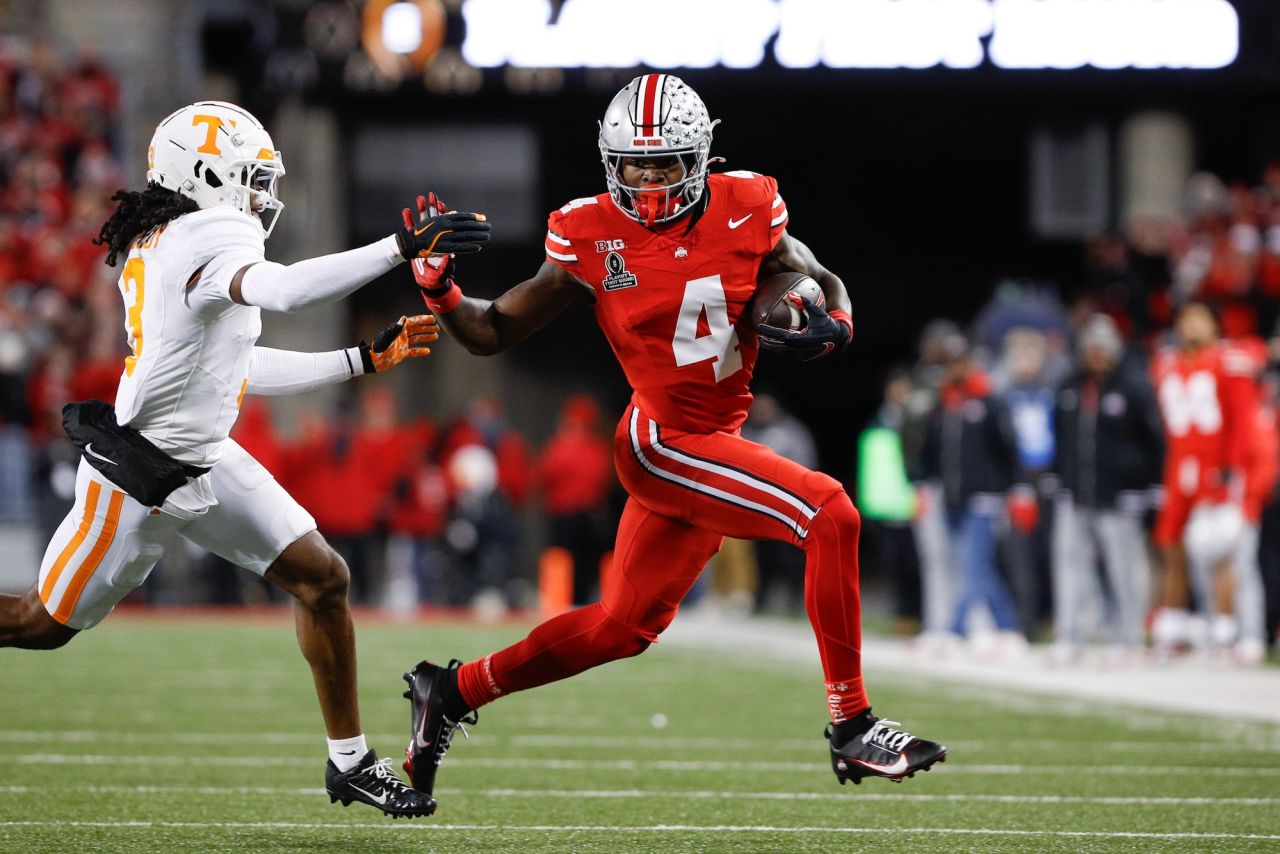 Ohio State Buckeyes wide receiver Jeremiah Smith carries the ball in the second half.