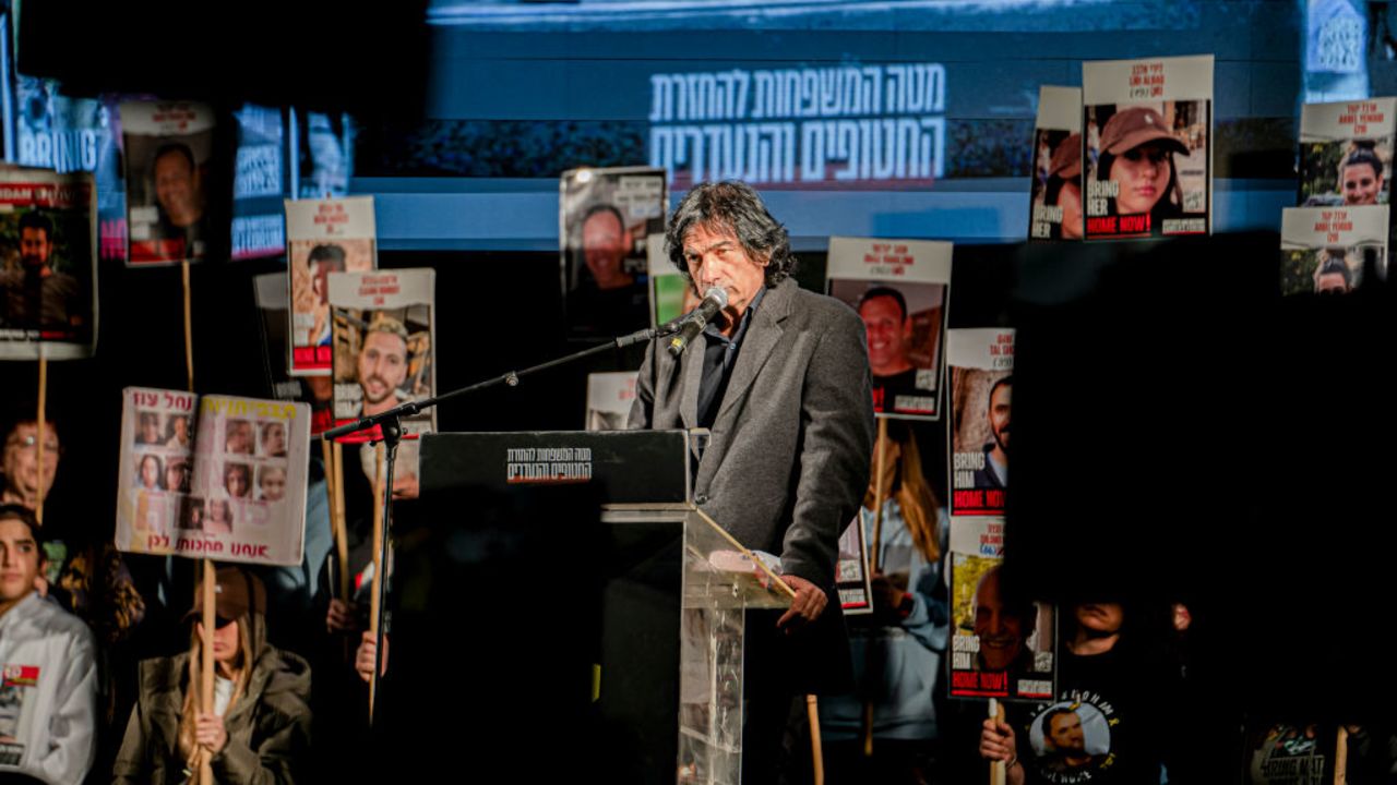 Families of hostages and supporters hold signs during a rally calling for the Israeli government to seal a hostage deal with Hamas on December 21, 2024 in Tel Aviv, Israel. Negotiations over a cease-fire in Gaza and the release of Israeli hostages held there have reportedly picked up steam after being stalled for months. Around 100 hostages remain in Gaza, although a third of them are presumed to be dead. (Photo by Ori Aviram / Middle East Images / Middle East Images via AFP) (Photo by ORI AVIRAM/Middle East Images/AFP via Getty Images)