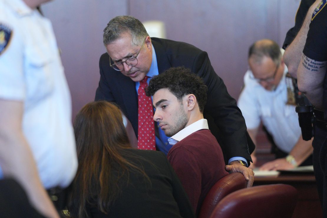  Luigi Mangione listens to his attorneys during a court hearing on the state charges against him.