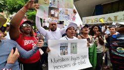 People demonstrate against the disappearance of four adolescent boys who went missing during a military operation two weeks ago while they were out playing football, in front of the prosecutor's office in Guayaquil, Ecuador, on December 23, 2024. Ecuador's President Daniel Noboa has ordered an intensified search for the boys, aged between 11 and 15, as public anger over the incident flared weeks ahead of elections. But, in a radio interview on Monday, Noboa also said that a "technical analysis" was needed before the incident could be called a forced disappearance -- despite prosecutors saying it was being investigated as an illegitimate use of force. (Photo by MARCOS PIN / AFP) (Photo by MARCOS PIN/AFP via Getty Images)