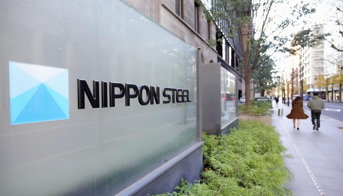 The logo of Nippon Steel seen in front of the building that houses the Japanese steel company's headquarters in Tokyo on December 24, 2024